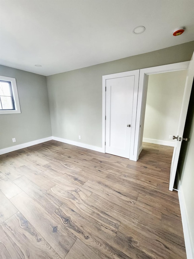 unfurnished room with light hardwood / wood-style flooring