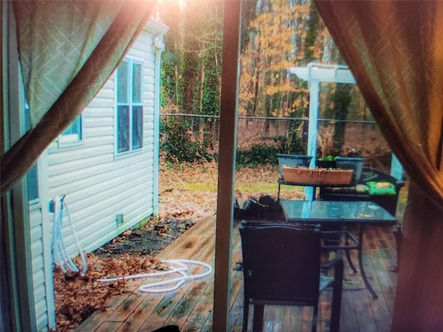 view of patio / terrace featuring a wooden deck and an outdoor bar