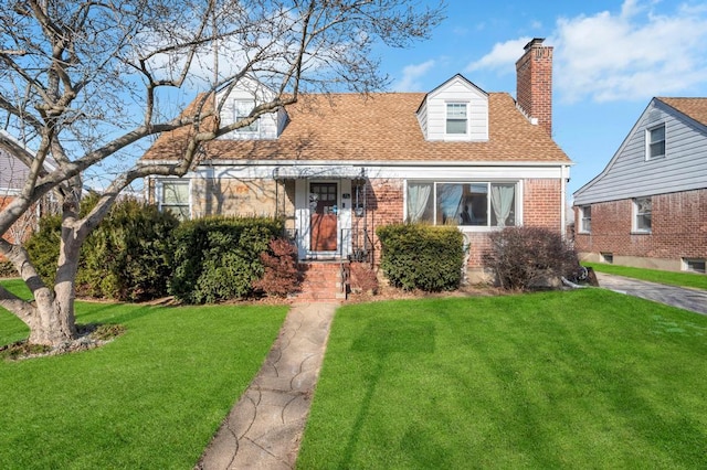 cape cod home with a front yard