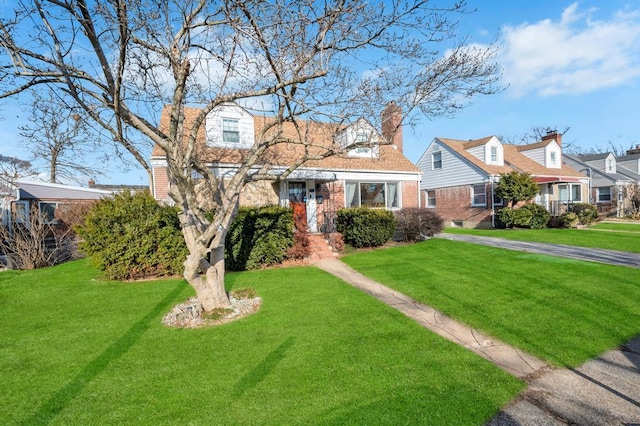 cape cod-style house with a front lawn