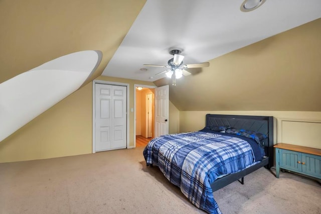 bedroom with ceiling fan, lofted ceiling, and carpet