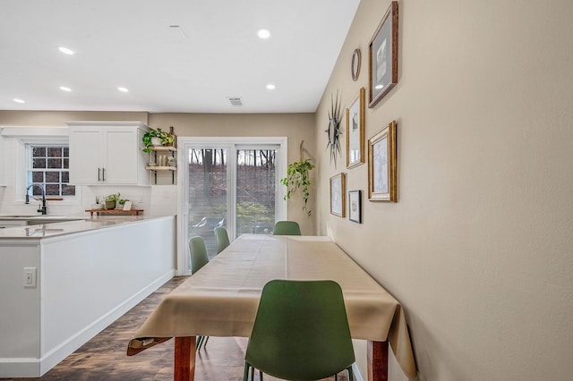 dining area with hardwood / wood-style floors