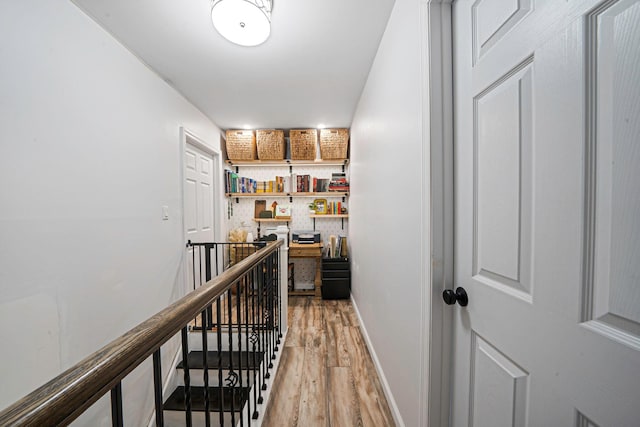 corridor featuring wood-type flooring