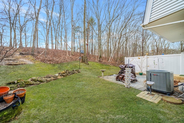 view of yard with cooling unit and a patio area