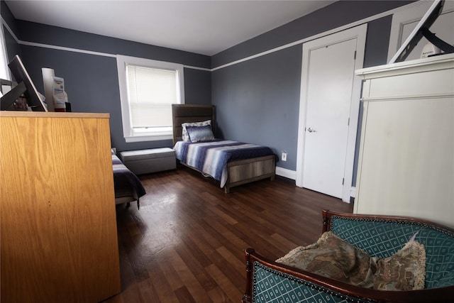 bedroom featuring dark wood-type flooring