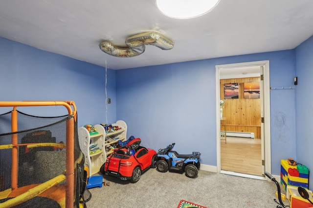 bedroom featuring carpet floors and a baseboard radiator