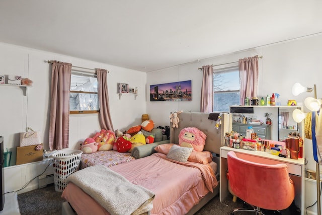 bedroom featuring carpet floors and baseboard heating