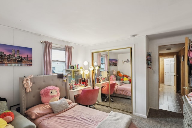 carpeted bedroom with a closet