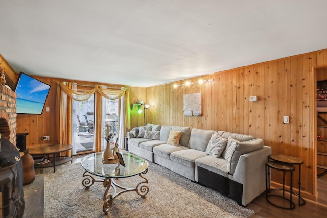 living room featuring wood walls