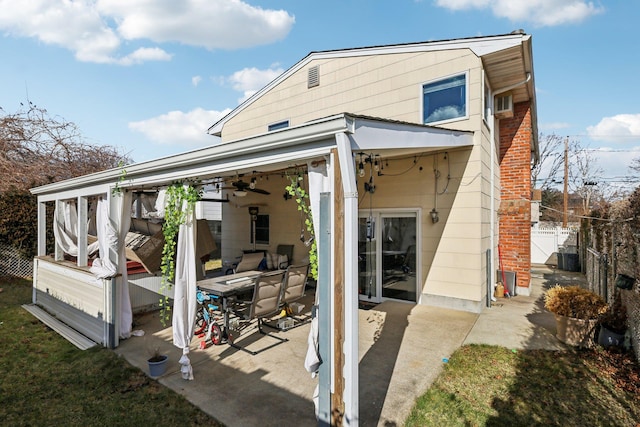 back of property with a patio