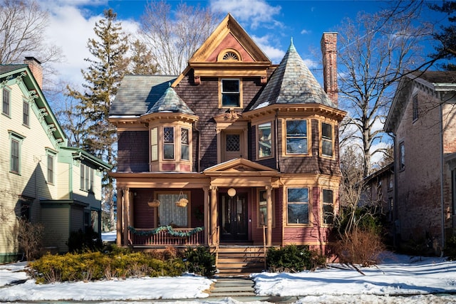 victorian-style house featuring covered porch