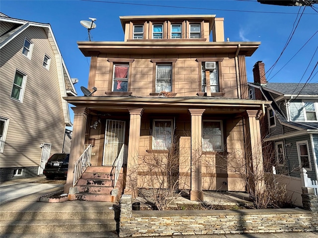 view of front of property featuring covered porch