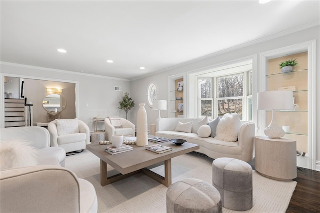 living area featuring ornamental molding, recessed lighting, and wood finished floors