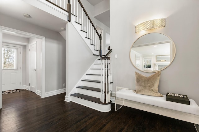 stairs with baseboards and wood finished floors