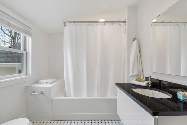 full bathroom featuring vanity, toilet, and shower / bathtub combination with curtain