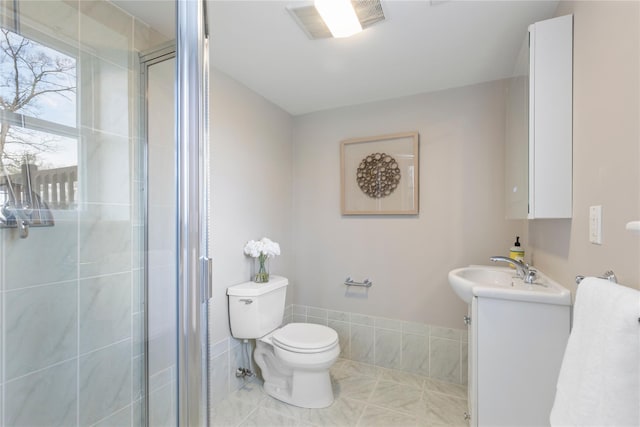 bathroom featuring visible vents, toilet, a shower stall, vanity, and tile patterned floors