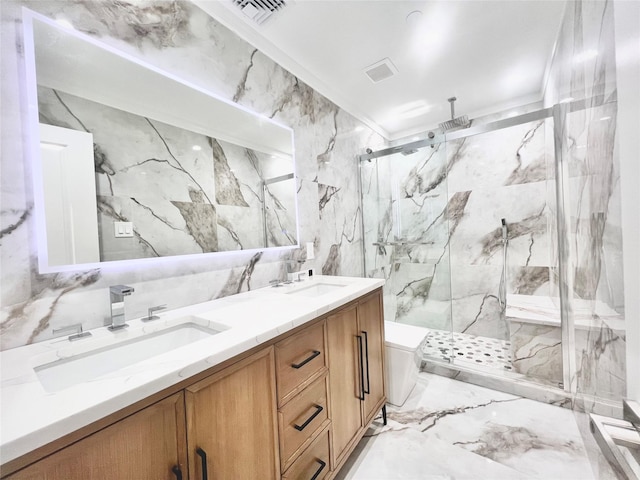 bathroom featuring a shower with door, vanity, ornamental molding, and tile walls