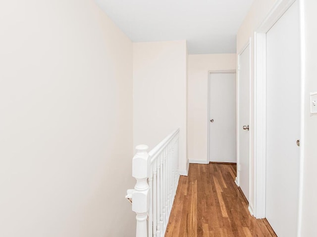 corridor featuring wood-type flooring