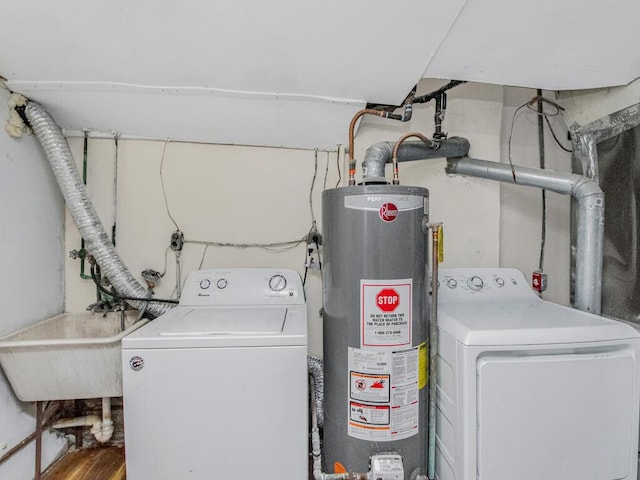 laundry area featuring sink, washer / dryer, and gas water heater