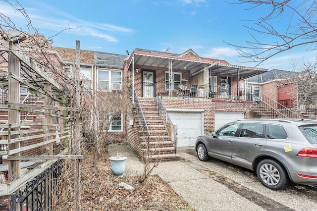 view of property featuring a garage and a porch