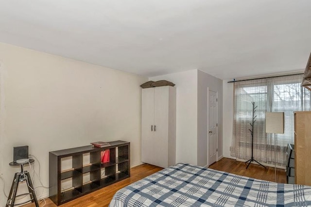 bedroom featuring dark hardwood / wood-style flooring