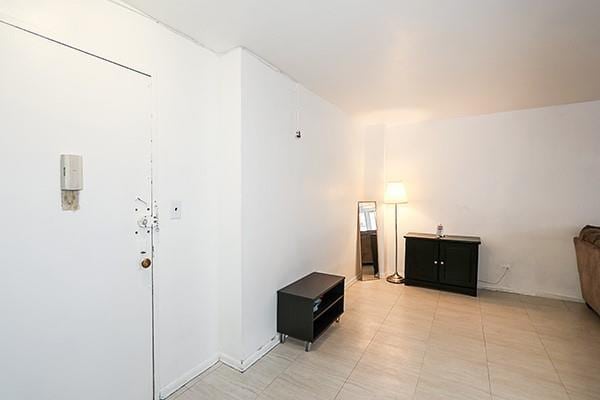 interior space featuring light tile patterned floors