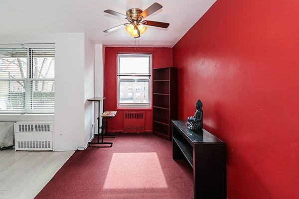 home office featuring radiator and ceiling fan