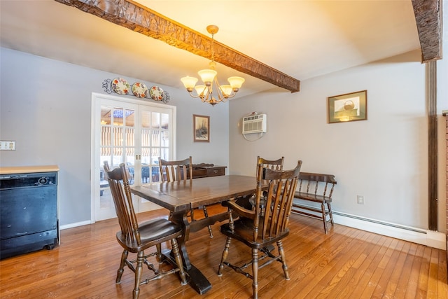 dining area featuring hardwood / wood-style flooring, a wall mounted air conditioner, an inviting chandelier, and beamed ceiling