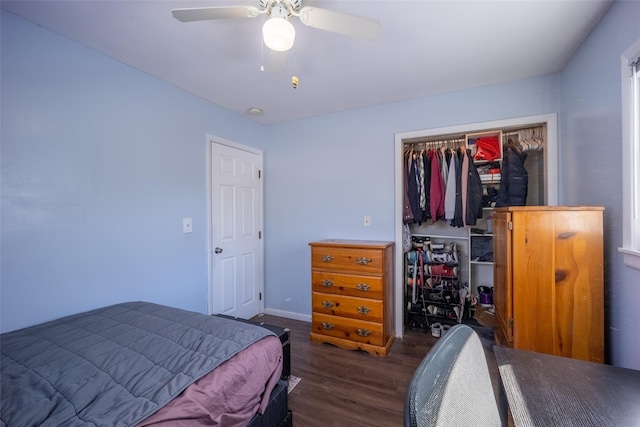 bedroom featuring dark wood-type flooring, ceiling fan, and a closet