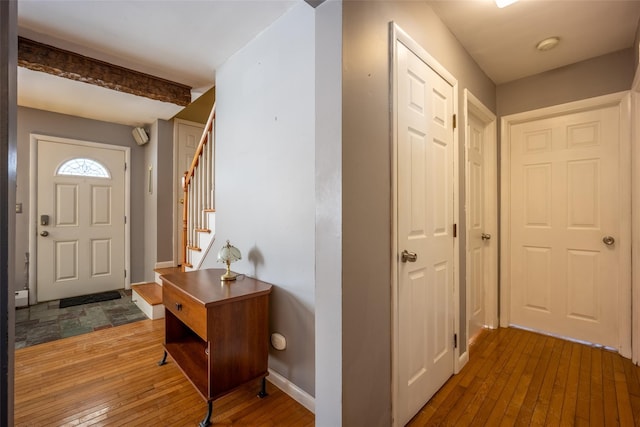 foyer entrance featuring hardwood / wood-style floors