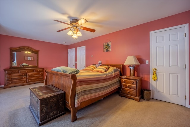 carpeted bedroom with ceiling fan