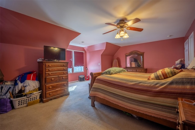 carpeted bedroom featuring vaulted ceiling and ceiling fan