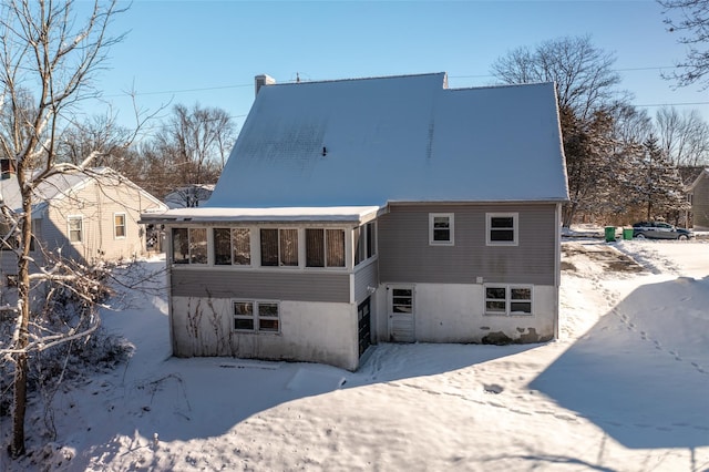 view of snow covered house