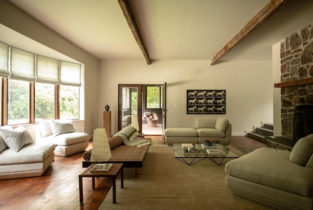 living room with french doors, a fireplace, wood-type flooring, and beam ceiling