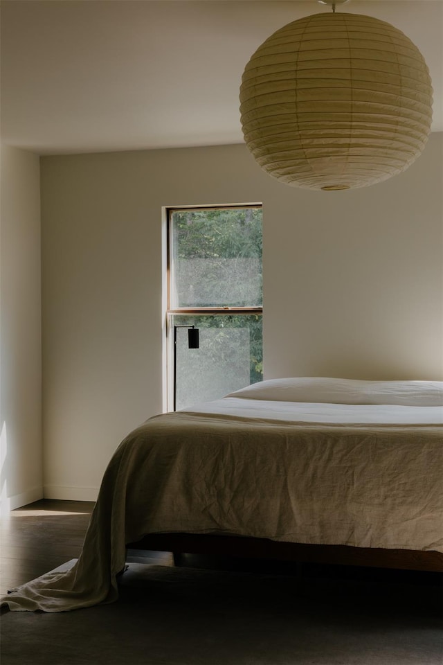 bedroom with wood-type flooring