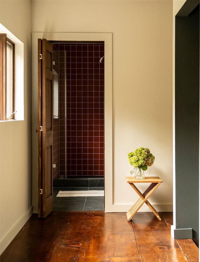 corridor featuring dark hardwood / wood-style flooring