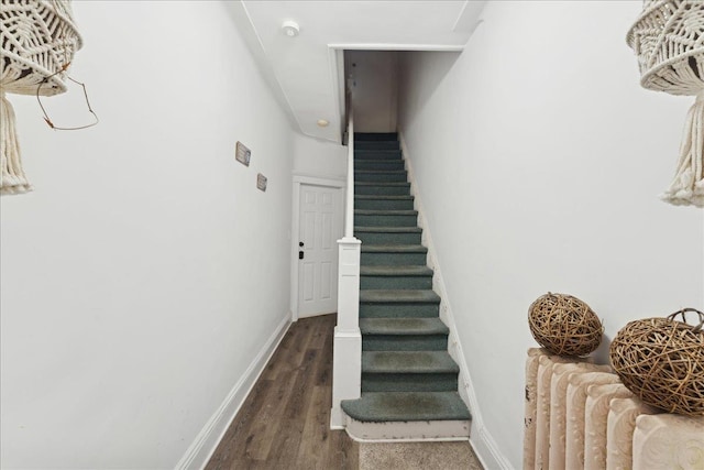 stairs with hardwood / wood-style flooring