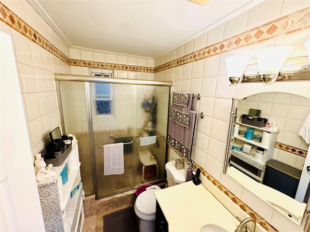 bathroom with toilet, a shower with shower door, sink, and tile walls