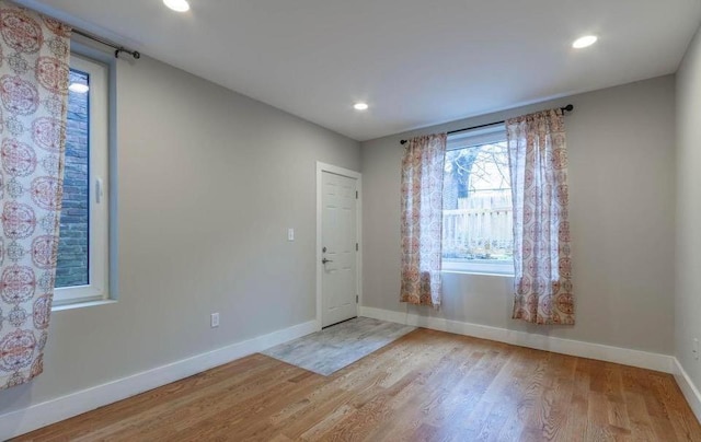 spare room featuring light wood-type flooring