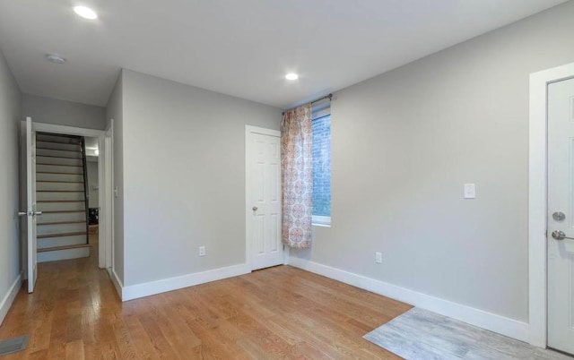 unfurnished bedroom featuring light wood-type flooring