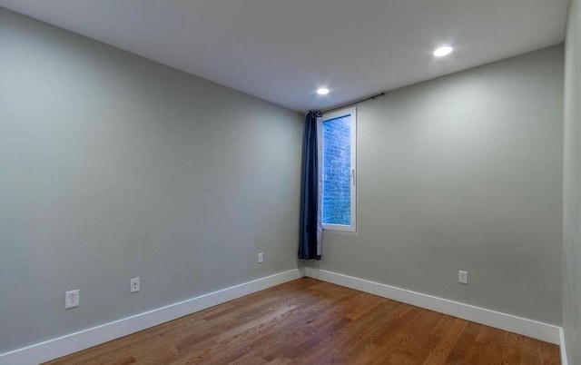 empty room featuring hardwood / wood-style floors