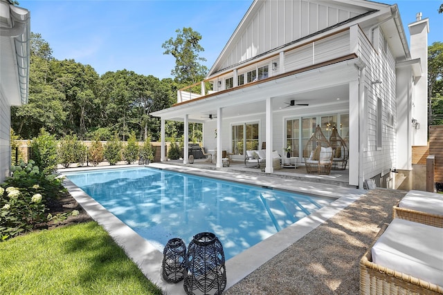 view of swimming pool featuring an outdoor living space, a patio, and ceiling fan