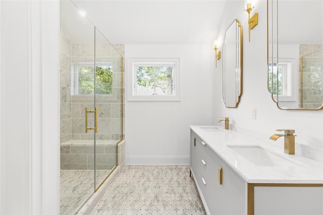 bathroom featuring vanity and a shower with door