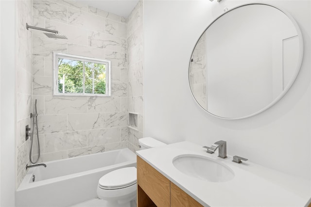 full bathroom featuring tiled shower / bath combo, vanity, and toilet