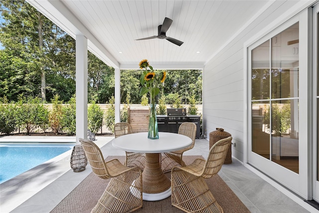 sunroom / solarium with wood ceiling and ceiling fan