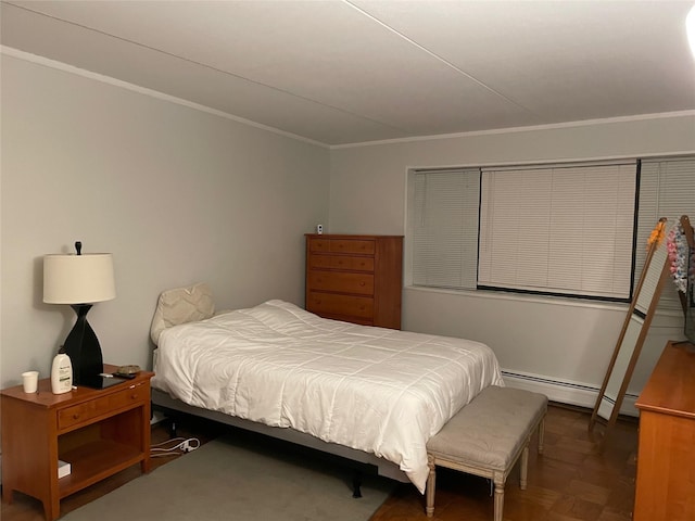 bedroom with a baseboard radiator and crown molding