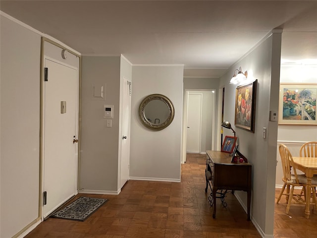 hall featuring ornamental molding and dark parquet flooring