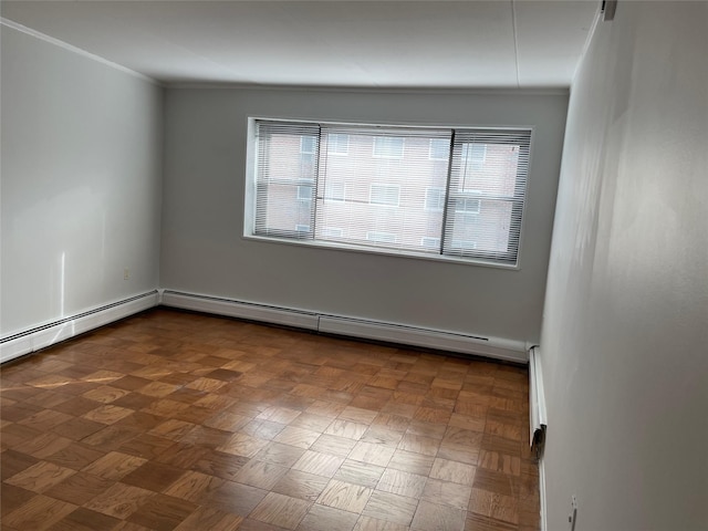 empty room featuring a baseboard radiator, ornamental molding, and a wealth of natural light