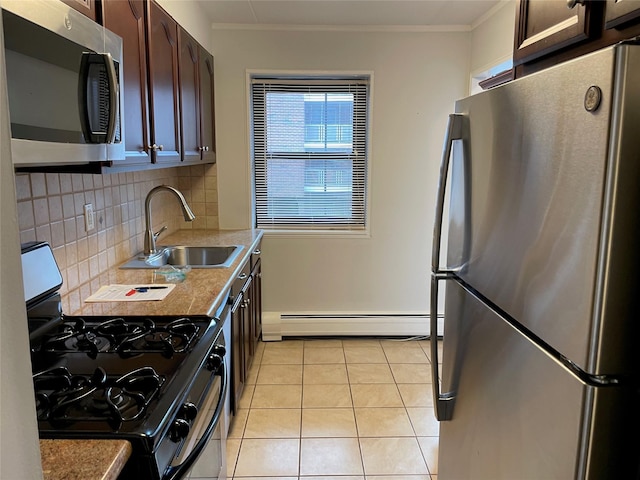 kitchen featuring sink, light tile patterned floors, baseboard heating, stainless steel appliances, and dark brown cabinetry