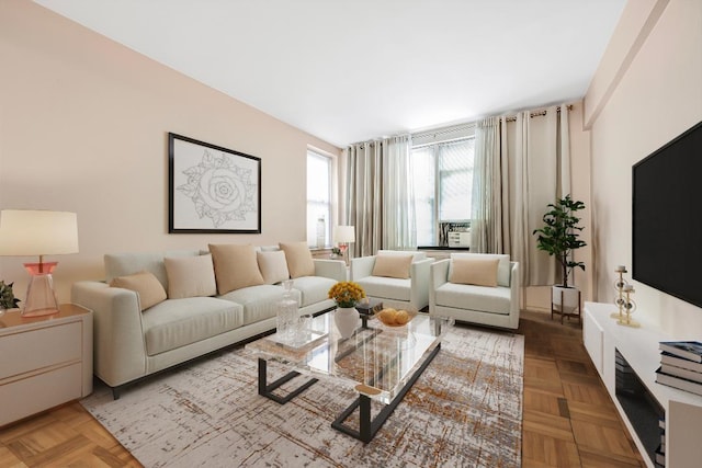 living room featuring parquet flooring